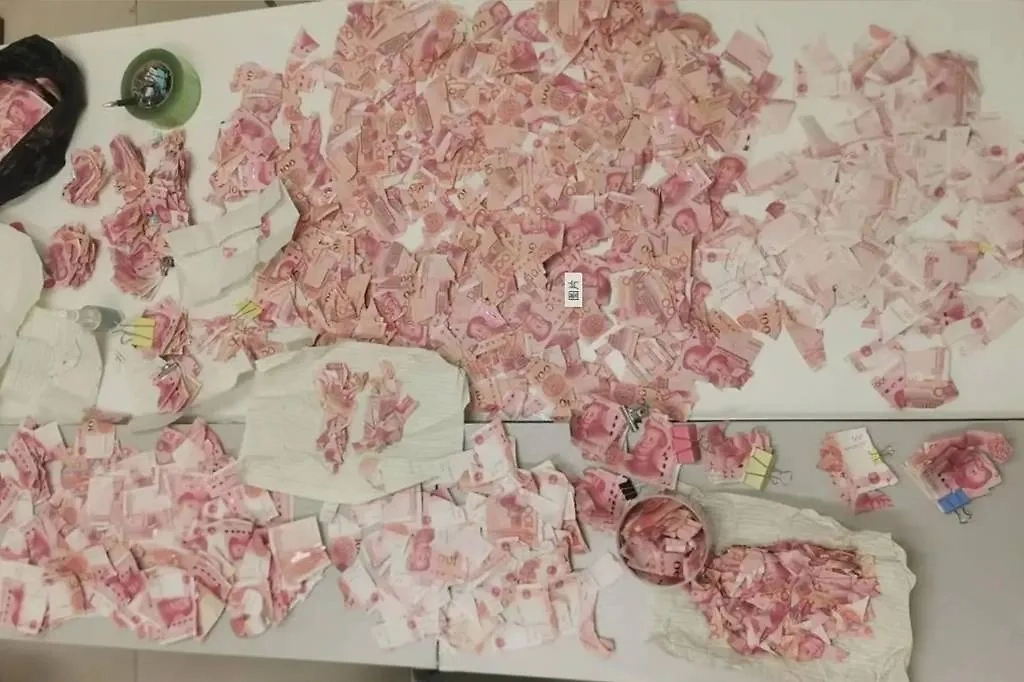 В Китае банк восстановил разрезанные женщиной в депрессии 32 тысячи юаней. Фото © South China Morning Post (SCMP) / Baidu