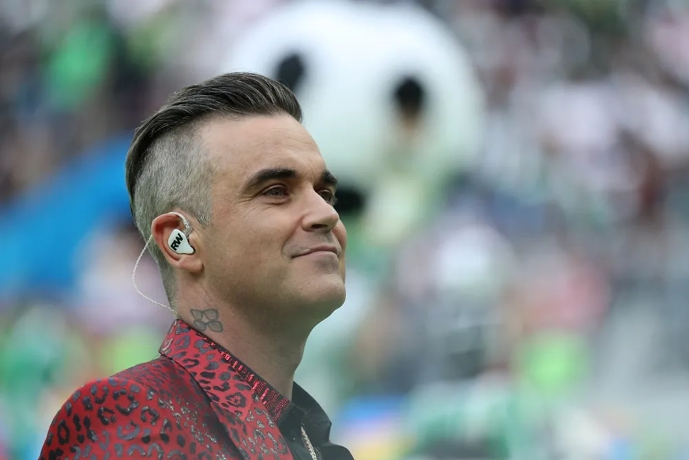 Робби Уильямс. Обложка © РИА Новости / Рамиль Ситдиков