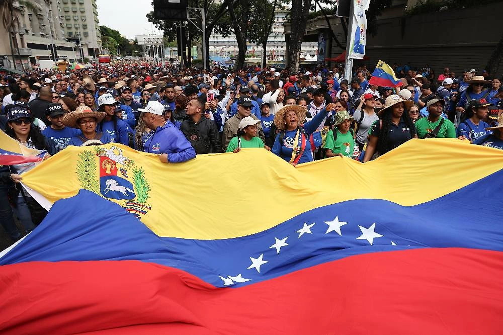 Обложка © TACC / EPA / MIGUEL GUTIERREZ