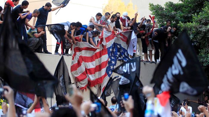 %D0%92%D0%BE%D0%BE%D1%80%D1%83%D0%B6%D0%B5%D0%BD%D0%BD%D1%8B%D0%B5%20%D0%BF%D1%80%D0%BE%D1%82%D0%B5%D1%81%D1%82%D0%B0%D0%BD%D1%82%D1%8B%20%D0%BD%D0%B0%D0%BF%D0%B0%D0%BB%D0%B8%20%D0%BD%D0%B0%20%D0%B4%D0%B8%D0%BF%D0%BC%D0%B8%D1%81%D1%81%D0%B8%D1%8E%20%D0%A1%D0%A8%D0%90%20%D0%B0%20%D0%9B%D0%B8%D0%B2%D0%B8%D0%B8%20%D0%B8%20%D0%B2%20%D0%9A%D0%B0%D0%B8%D1%80%D0%B5%20(%D1%84%D0%BE%D1%82%D0%BE%3A%20Reuters)