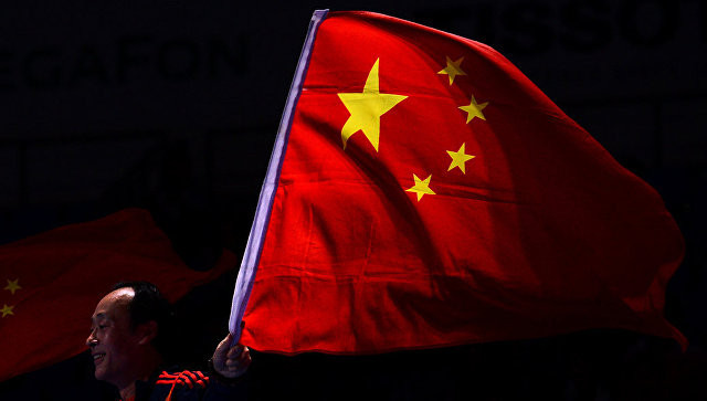 Спортсмен с флагом Китая. Фото: &copy; РИА Новости/Рамиль Ситдиков
