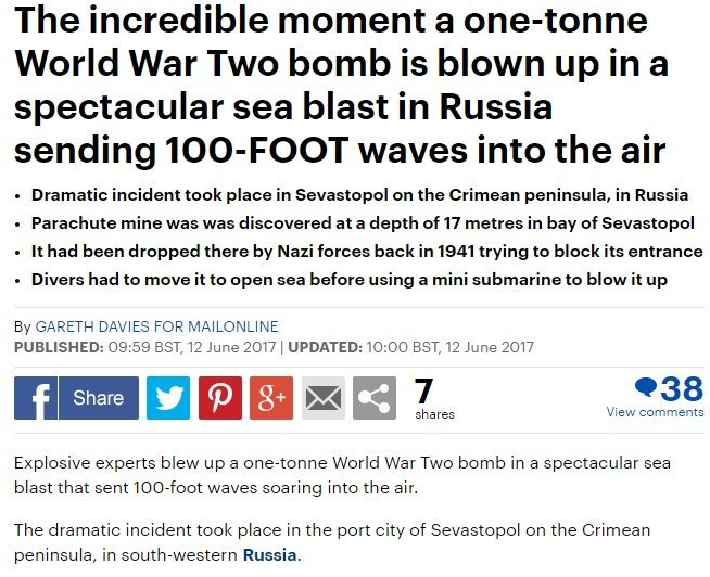 Заголовок гласит: "Незабываемый момент, когда взрывом бомбы весом в одну тонну в море в России поднимается волна высотой 100 футов". Фото: Daily Mail