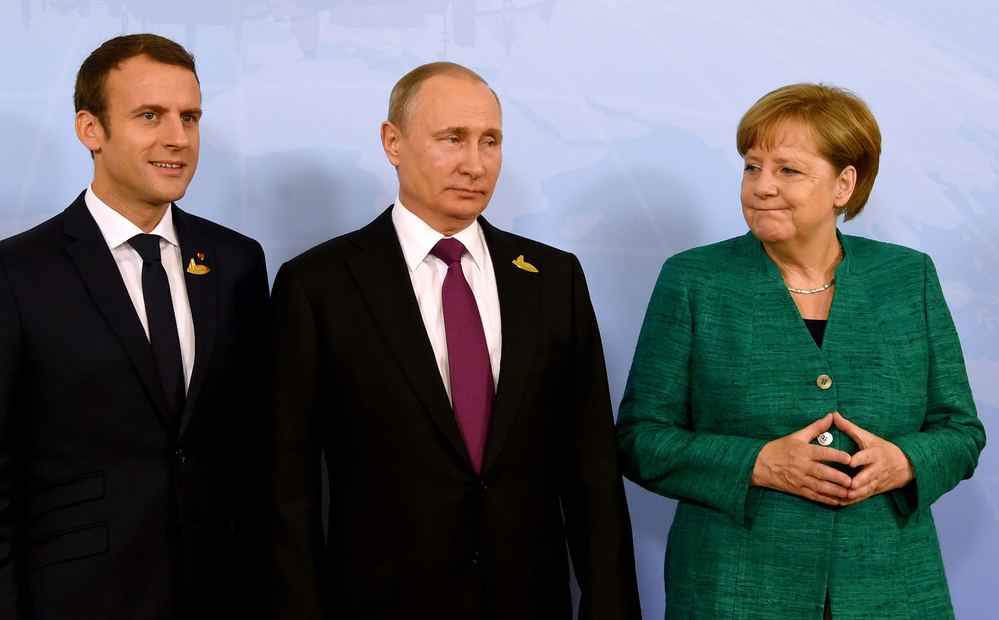 Эммануэль Макрон, Владимир Путин и Ангела Меркель. Фото: &copy;REUTERS