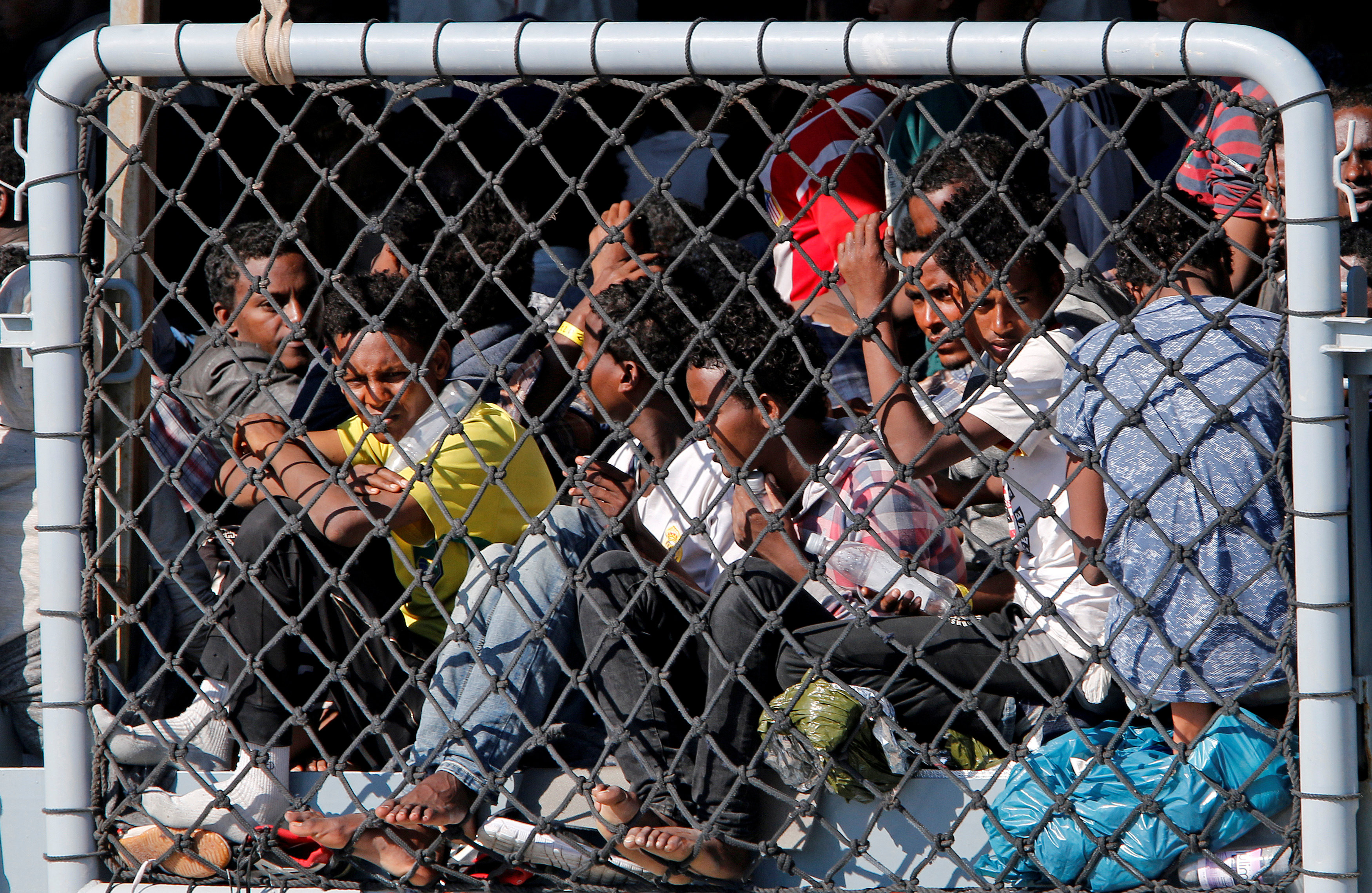 Мигранты. Фото: &copy; REUTERS/Antonio Parrinello