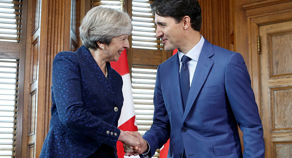 Премьер-министр Великобритании Тереза Мэй и премьер-министр Канады Джастин Трюдо. Фото: &copy;&nbsp;REUTERS/ Chris Wattie