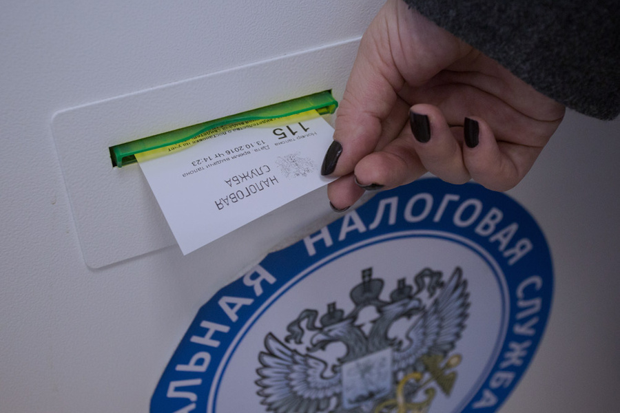 Получение талона электронной очереди в инспекции Федеральной налоговой. Фото © ТАСС / Феоктистов Дмитрий
