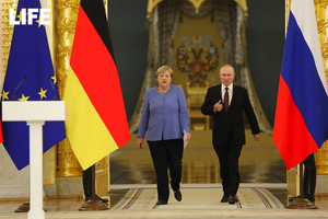 Путин попросил Меркель повлиять на Киев в плане выполнения им своих обязательств