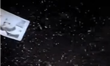 Летящая на тёмном фоне фотография актёра Олега Басилашвили, первоначально утверждённого на роль Ипполита. Кадр @ Youtube / Киноконцерн "Мосфильм"