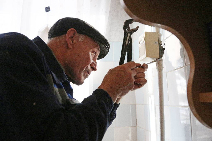 Проверка газового оборудования в жилых домах. Фото © ТАСС / Евгений Софийчук