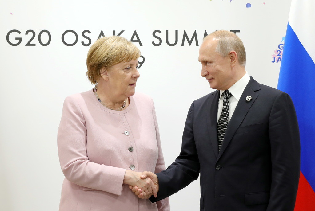 &nbsp;Ангела Меркель и Владимир Путин. Фото © ТАСС / Михаил Климентьев
